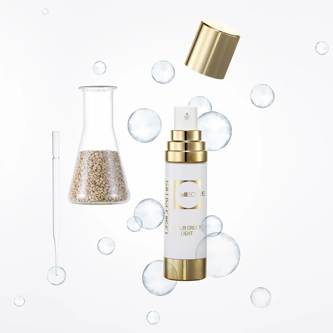 Skincare product with gold cap and white body on a white background with bubbles