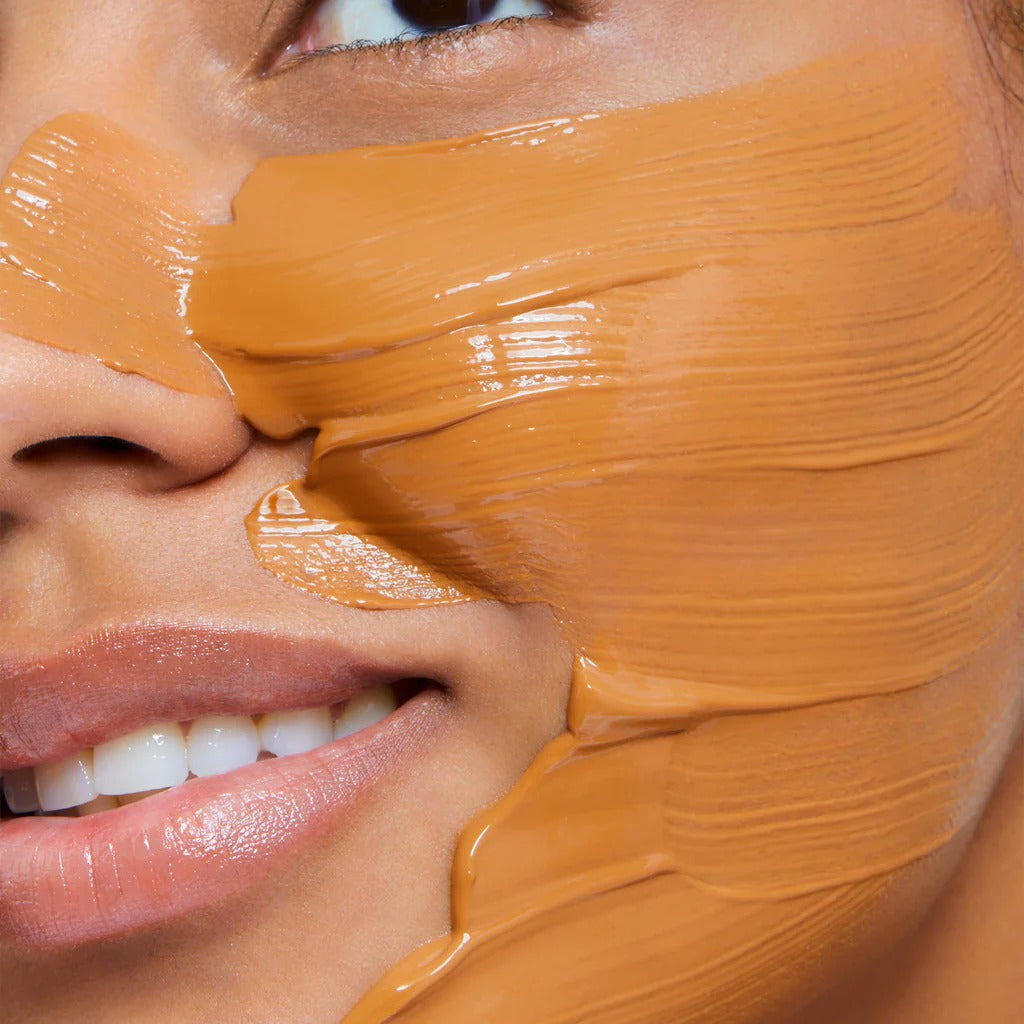 Close-up of a person's face with brown makeup applied to the cheeks and nose.
