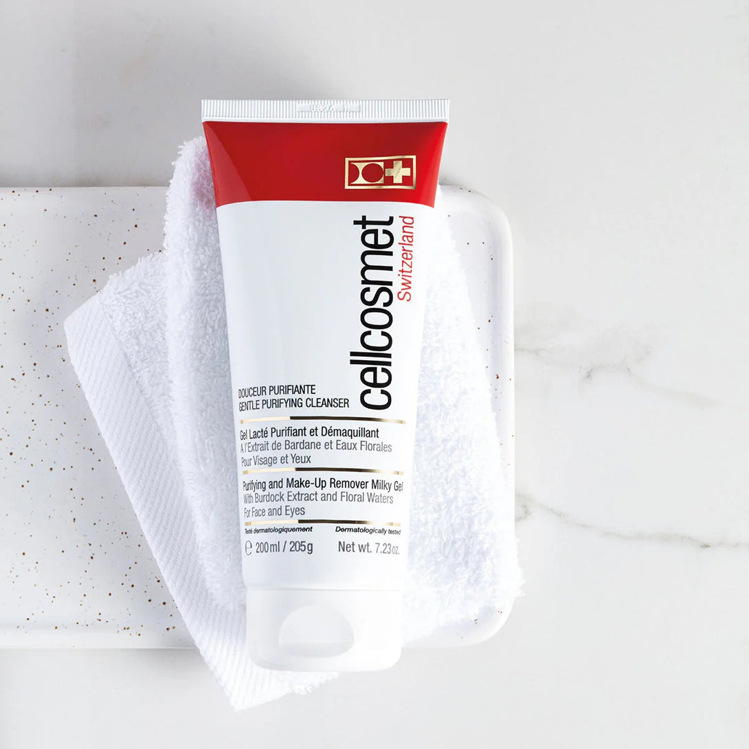Tube of cellocosmet Swiss skincare product on a white towel