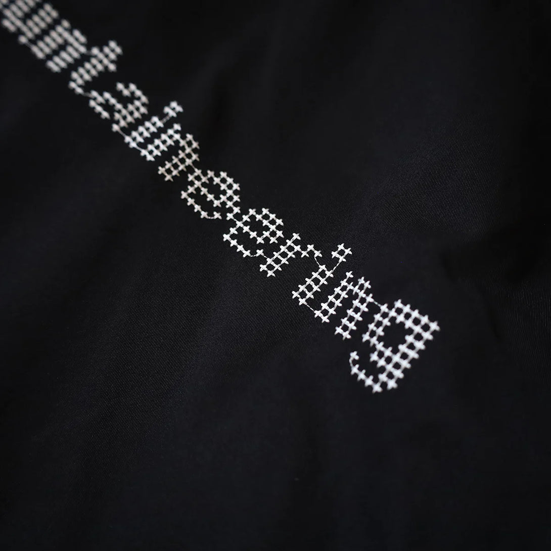 WHITE MOUNTAINEERING WINDSTOPPER CROSS STITCH COACH JACKET – D-mop
