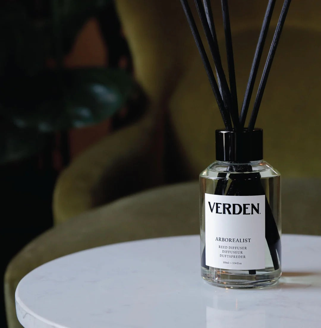 Verden diffuser bottle on a table with a blurred background