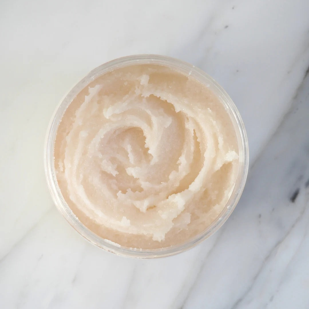 Jar of beige cream on a marble surface